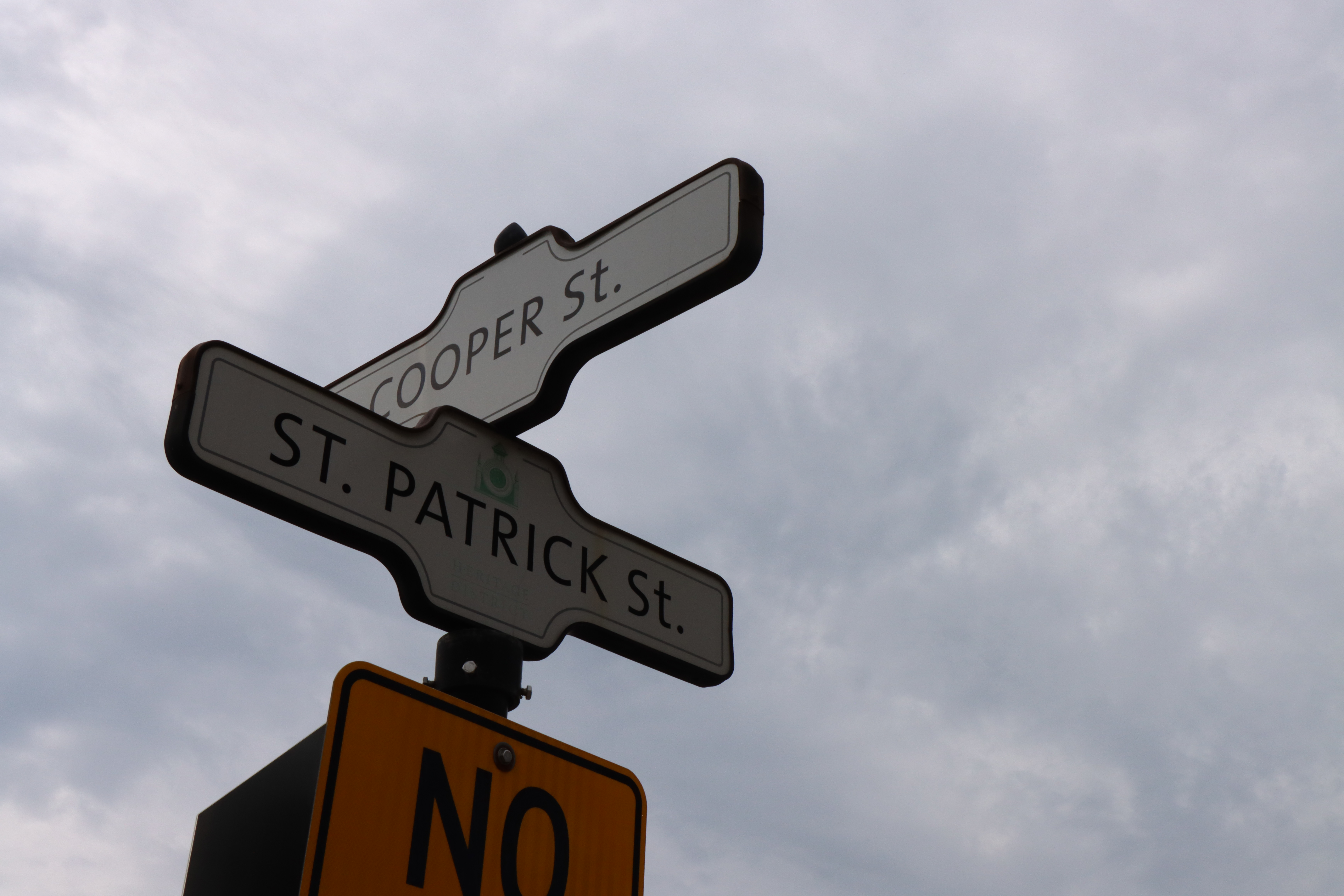 Two street signs intersecting.